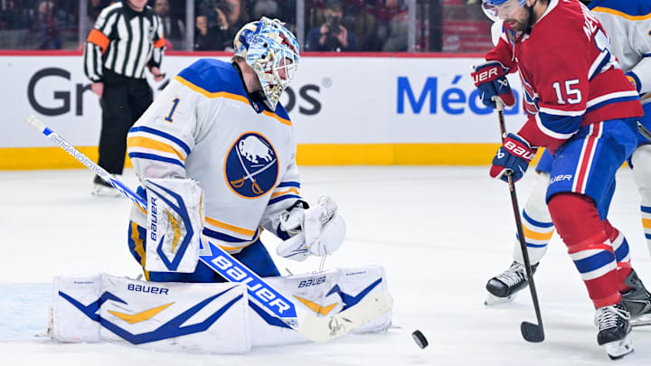 May 12, 2026; Montreal, Quebec, CAN; Buffalo Sabres goalie Ukko-Pekka Luukkonen (1) stops Montreal Canadiens forward Alex Newhook (15) during the third period in game four of the second round of the 2026 Stanley Cup Playoffs at Bell Centre. Mandatory Credit: Eric Bolte-Imagn Images
