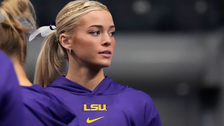 LSU gymnast Livvy Dunne stretches with teammates before Session 2 of the SEC Gymnastics Tournament at Legacy Arena in Birmingham, Alabama.