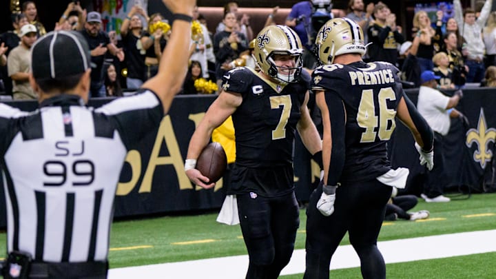 Nov 17, 2024; New Orleans, Louisiana, USA; New Orleans Saints tight end Taysom Hill (7) celebrates a touchdown during the fourth quarter against the Cleveland Browns with New Orleans Saints fullback Adam Prentice (46) at Caesars Superdome. Mandatory Credit: Matthew Hinton-Imagn Images