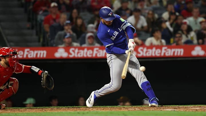 May 7, 2025; Anaheim, California, USA;  Toronto Blue Jays designated hitter Anthony Santander (25) hits an RBI single during the sixth inning against the Los Angeles Angels at Angel Stadium.