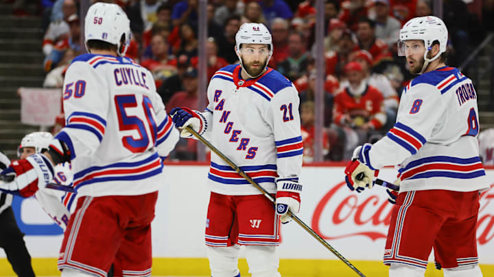 May 26, 2024; Sunrise, Florida, USA; New York Rangers center Barclay Goodrow (21) talks to defenseman Jacob Trouba (8) and left wing Will Cuylle (50) during the first period in game three of the Eastern Conference Final of the 2024 Stanley Cup Playoffs at Amerant Bank Arena. Mandatory Credit: Sam Navarro-Imagn Images