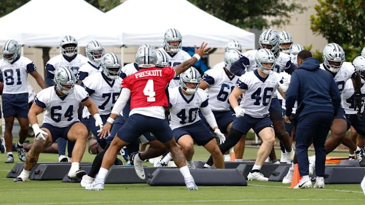 Dallas Cowboys QB Dak Prescott leads teammates through a drill at the Ford Center at the Star Training Facility in Frisco. Dallas Cowboys QB Dak Prescott leads teammates through a drill at the Ford Center at the Star Training Facility in Frisco.