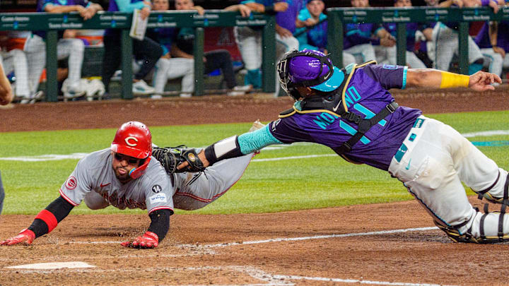 Aug 22, 2025; Phoenix, Arizona, USA; Arizona Diamondbacks catcher Gabriel Moreno (14) dives to tag out Cincinnati Reds catcher Jose Trevino (35) as he dives to beat the tag at home base in the top of the tenth inning at Chase Field. Mandatory Credit: Allan Henry-Imagn Images Aug 22, 2025; Phoenix, Arizona, USA; Arizona Diamondbacks catcher Gabriel Moreno (14) dives to tag out Cincinnati Reds catcher Jose Trevino (35) as he dives to beat the tag at home base in the top of the tenth inning at Chase Field. Mandatory Credit: Allan Henry-Imagn Images