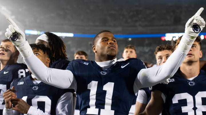 Penn State linebacker Abdul Carter conducts the Blue Band's playing of the alma mater after a Nittany Lions victory at Beaver Stadium. 