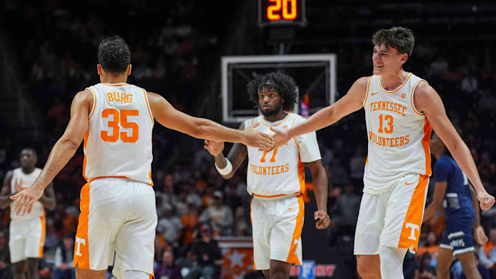 Tennessee forward J.P. Estrella (13) and Tennessee guard Ethan Burg (35) high-five during a NCAA basketball game between Tennessee Volunteers and North Florida Ospreys at Thompson-Boling Arena at Food City Center in Knoxville, Tenn. on Nov. 12, 2025.