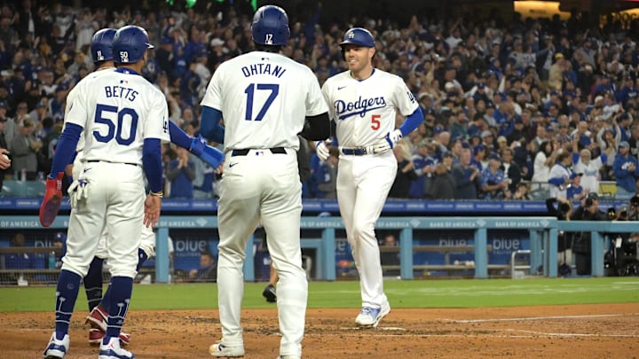 May 20, 2024; Los Angeles, California, USA; Los Angeles Dodgers first baseman Freddie Freeman (5) is greeted at the plate by second baseman Miguel Rojas (11), shortstop Mookie Betts (50) and designated hitter Shohei Ohtani (17) after hitting a grand slam home run in the third inning against the Arizona Diamondbacks at Dodger Stadium. Mandatory Credit: Jayne Kamin-Oncea-Imagn Images May 20, 2024; Los Angeles, California, USA; Los Angeles Dodgers first baseman Freddie Freeman (5) is greeted at the plate by second baseman Miguel Rojas (11), shortstop Mookie Betts (50) and designated hitter Shohei Ohtani (17) after hitting a grand slam home run in the third inning against the Arizona Diamondbacks at Dodger Stadium. Mandatory Credit: Jayne Kamin-Oncea-Imagn Images