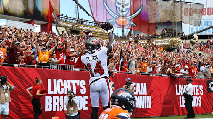 Sep 22, 2024; Tampa, Florida, USA; Tampa Bay Buccaneers wide receiver Chris Godwin (14) celebrates after he scored a touchdown against the Denver Broncos during the first half at Raymond James Stadium. Mandatory Credit: Kim Klement Neitzel-Imagn Images