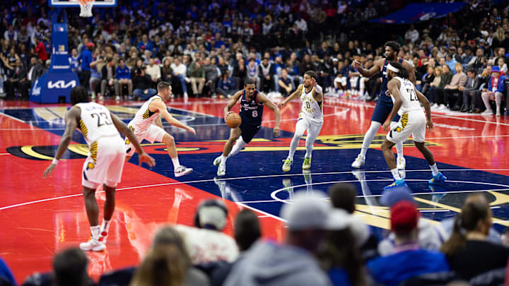Nov 14, 2023; Philadelphia, Pennsylvania, USA; Philadelphia 76ers guard De'Anthony Melton (8) dribbles up court past Indiana Pacers guard Tyrese Haliburton (0) and guard T.J. McConnell (9) during the first quarter at Wells Fargo Center. Mandatory Credit: Bill Streicher-Imagn Images