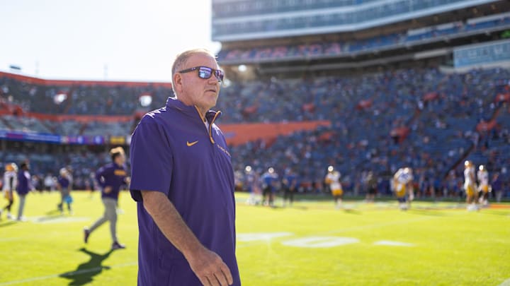 Nov 16, 2024; Gainesville, Florida, USA; LSU Tigers head coach Brian Kelly walks onto the field before a game against the Florida Gators at Ben Hill Griffin Stadium. Mandatory Credit: Matt Pendleton-Imagn Images