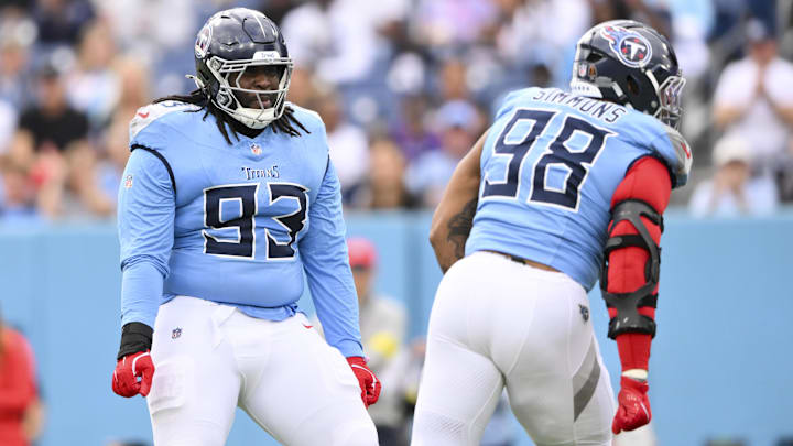 Dec 28, 2025; Nashville, Tennessee, USA;  Tennessee Titans defensive tackle Jeffery Simmons (98) and defensive tackle T'Vondre Sweat (93) celebrate a New Orleans Saints fumble during the first quarter of the game at Nissan Stadium. Mandatory Credit: Steve Roberts-Imagn Images