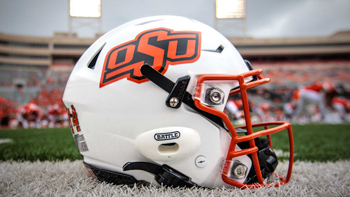 Aug 31, 2024; Stillwater, Oklahoma, USA; Oklahoma State Cowboys helmet sits on the field prior to the game against the South Dakota State Jackrabbits at Boone Pickens Stadium. Mandatory Credit: William Purnell-Imagn Images Aug 31, 2024; Stillwater, Oklahoma, USA; Oklahoma State Cowboys helmet sits on the field prior to the game against the South Dakota State Jackrabbits at Boone Pickens Stadium. Mandatory Credit: William Purnell-Imagn Images