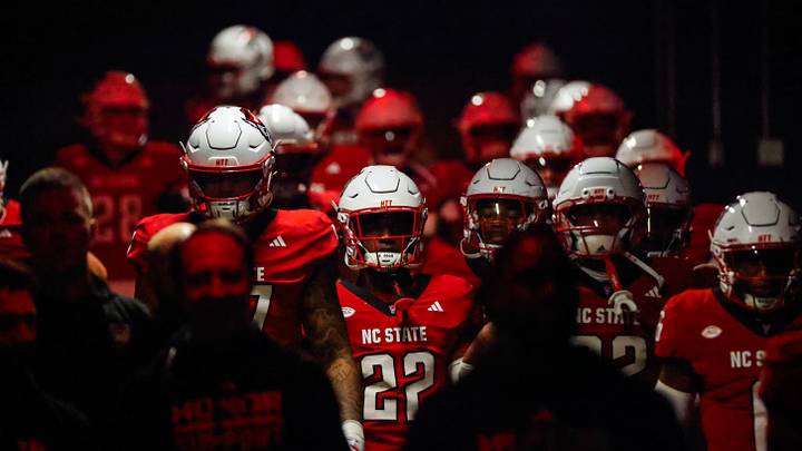 Nov 21, 2025; Raleigh, North Carolina, USA; NC State Wolfpack walk out prior to the first half of the game against Florida State Seminoles at Carter-Finley Stadium. Mandatory Credit: Jaylynn Nash-Imagn Images Nov 21, 2025; Raleigh, North Carolina, USA; NC State Wolfpack walk out prior to the first half of the game against Florida State Seminoles at Carter-Finley Stadium. Mandatory Credit: Jaylynn Nash-Imagn Images