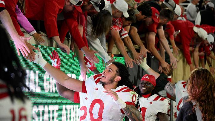 Nebraska players celebrate with fans at Spartan Stadium after the Huskers' 31-13 win against Michigan State on Saturday. Nebraska players celebrate with fans at Spartan Stadium after the Huskers' 31-13 win against Michigan State on Saturday.