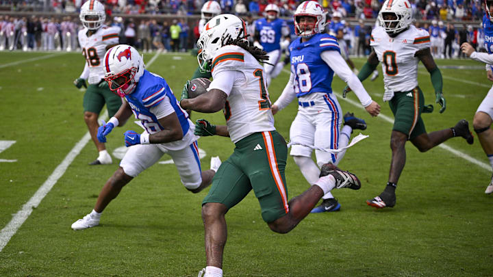 Nov 1, 2025; Dallas, Texas, USA;  Miami Hurricanes wide receiver Malachi Toney (10) returns a punt against the SMU Mustangs during the second quarter at Gerald J. Ford Stadium. Mandatory Credit: Jerome Miron-Imagn Images