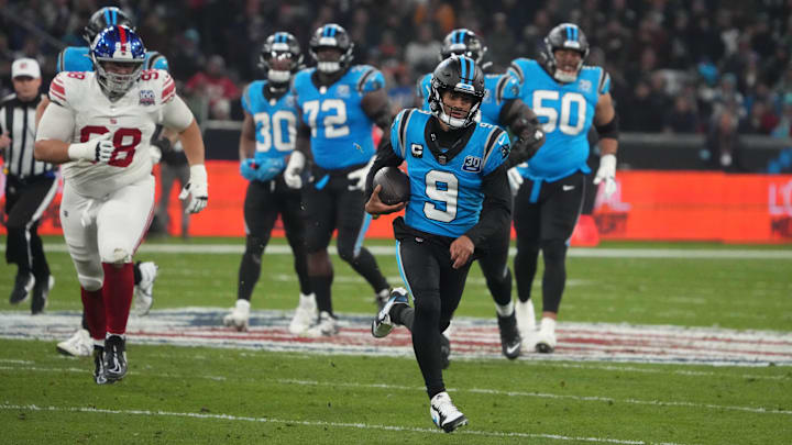 Nov 10, 2024; Munich, Germany; Carolina Panthers quarterback Bryce Young (9) carries the ball on a 24-yard run against the Carolina Panthers  n the second half during the 2024 NFL Munich Game at Allianz Arena. Mandatory Credit: Kirby Lee-Imagn Images