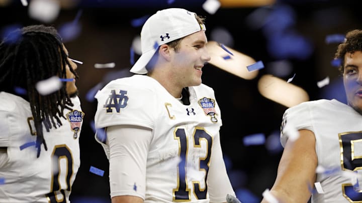 Notre Dame Fighting Irish quarterback Riley Leonard celebrates win against Georgia Bulldogs.