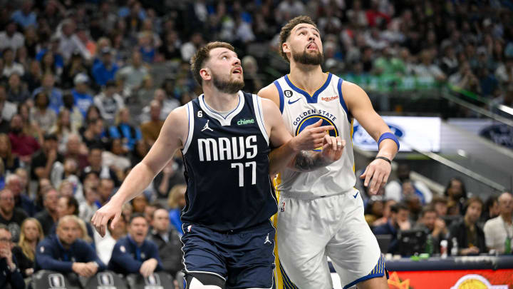Mar 22, 2023; Dallas, Texas, USA; Dallas Mavericks guard Luka Doncic (77) and Golden State Warriors guard Klay Thompson (11) in action during the game between the Dallas Mavericks and the Golden State Warriors at the American Airlines Center. Mandatory Credit: Jerome Miron-USA TODAY Sports