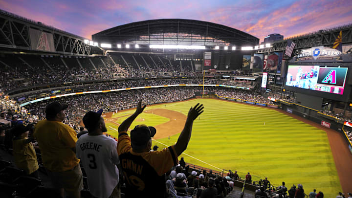Padres fans watch the sun set in the seventh inning during a game against the Diamondbacks at Chase Field in Phoenix on April 22, 2023.