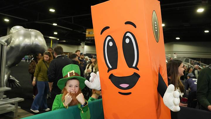 Jan 18, 2025; Atlanta, GA, USA; A Notre Dame Fighting Irish fan in a leprechaun costume poses with College Football Playoff mascot Perry the Pylon at 2025 CFP National Championship Media Day at Georgia World Congress Center, Building A. Jan 18, 2025; Atlanta, GA, USA; A Notre Dame Fighting Irish fan in a leprechaun costume poses with College Football Playoff mascot Perry the Pylon at 2025 CFP National Championship Media Day at Georgia World Congress Center, Building A.