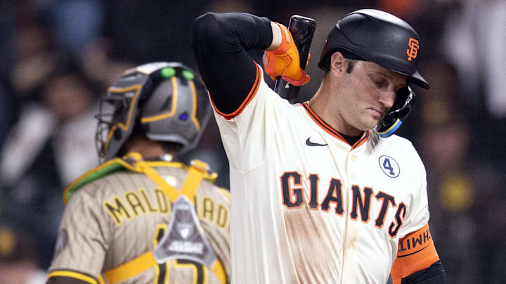 Jun 2, 2025; San Francisco, California, USA; San Francisco Giants first baseman Casey Schmitt (10) reacts after striking out to end the eighth inning against the San Diego Padres at Oracle Park.