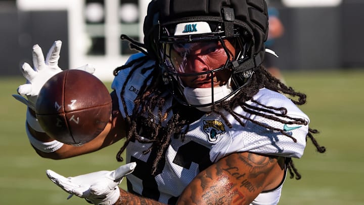 Jacksonville Jaguars safety Cam'Ron Silmon-Craig (32) hauls in a pass while running drills during an NFL training camp fifth session at the Miller Electric Center, Monday, July 28, 2025, in Jacksonville, Fla. [Doug Engle/Florida Times-Union]