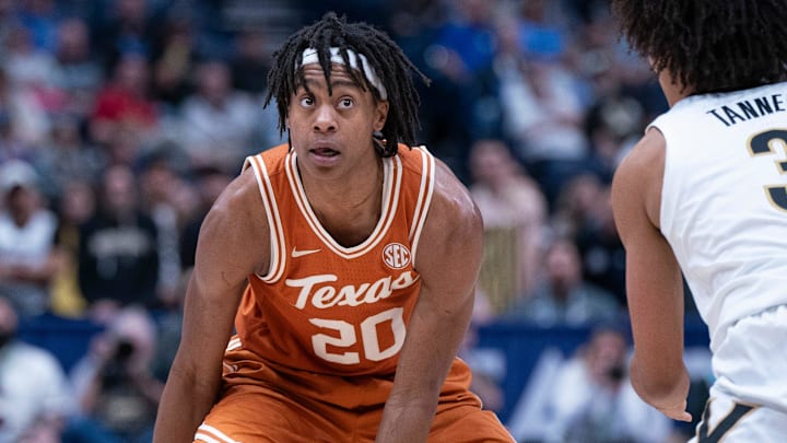 Texas Longhorns guard Tre Johnson (20) looks for an opening against Vanderbilt Commodores guard Tyler Tanner (3) during their first round game of the SEC Men's Basketball Tournament at Bridgestone Arena in Nashville, Tenn., Wednesday, March 12, 2025. Texas Longhorns guard Tre Johnson (20) looks for an opening against Vanderbilt Commodores guard Tyler Tanner (3) during their first round game of the SEC Men's Basketball Tournament at Bridgestone Arena in Nashville, Tenn., Wednesday, March 12, 2025.