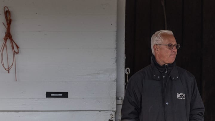 Trainer Todd Pletcher surveys his barn area as his Kentucky Derby entry, Fierceness, is bathed following a morning workout at Churchill Downs. Special to the Courier Journal by Pat McDonogh. 