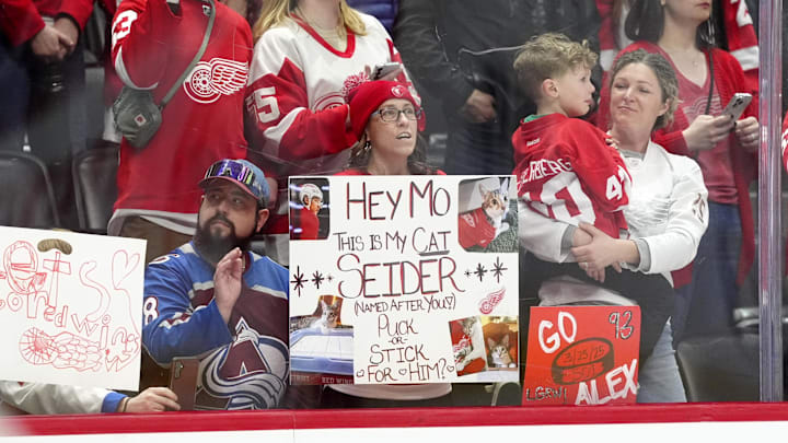 Mar 25, 2025; Denver, Colorado, USA; Detroit Red Wings and Colorado Avalanche fans cheer before the game at Ball Arena. Mandatory Credit: Ron Chenoy-Imagn Images