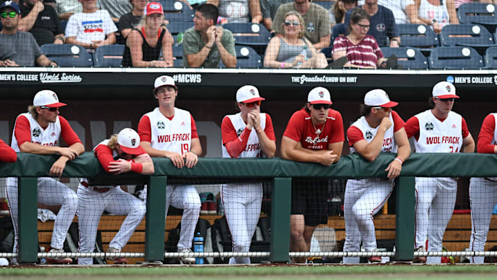 Jun 17, 2024; Omaha, NE, USA;  The NC State Wolfpack bench watches action against the Florida Gators during the ninth inning at Charles Schwab Field Omaha. Mandatory Credit: Steven Branscombe-Imagn Images