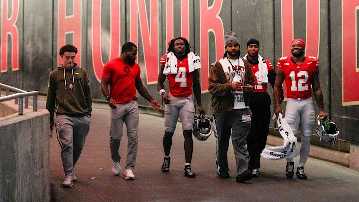 From left to right, R.J. Day, CJ Barnett, wide receiver Jeremiah Smith (4), J.T. Tuimoloau, linebacker C.J. Hicks (11) and running back CJ Donaldson Jr. (12) walk down the tunnel at halftime of the NCAA college football game at Ohio Stadium on Saturday, Nov. 15, 2025 in Columbus, Ohio. From left to right, R.J. Day, CJ Barnett, wide receiver Jeremiah Smith (4), J.T. Tuimoloau, linebacker C.J. Hicks (11) and running back CJ Donaldson Jr. (12) walk down the tunnel at halftime of the NCAA college football game at Ohio Stadium on Saturday, Nov. 15, 2025 in Columbus, Ohio.