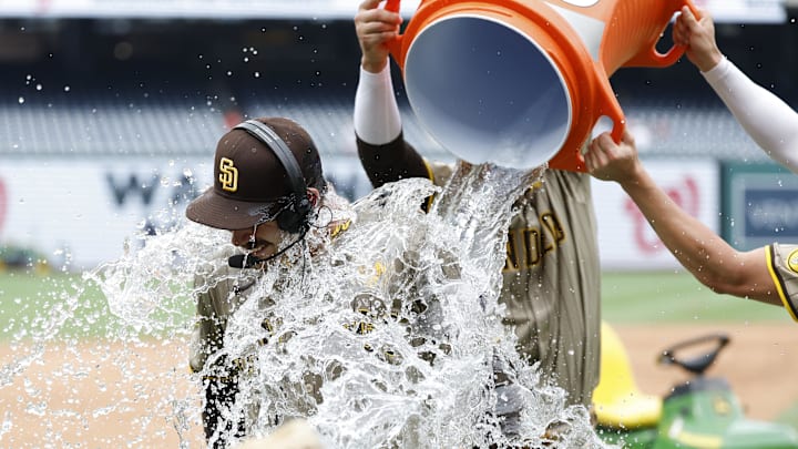 Jul 25, 2024; Washington, District of Columbia, USA; San Diego Padres pitcher Dylan Cease (84) is doused with a Gatorade cooler by Padres third baseman Manny Machado (13) and Padres third baseman Tyler Wade (14) while waiting for an on-air interview after throwing a no-hitter against the Washington Nationals at Nationals Park. Mandatory Credit: Geoff Burke-Imagn Images Jul 25, 2024; Washington, District of Columbia, USA; San Diego Padres pitcher Dylan Cease (84) is doused with a Gatorade cooler by Padres third baseman Manny Machado (13) and Padres third baseman Tyler Wade (14) while waiting for an on-air interview after throwing a no-hitter against the Washington Nationals at Nationals Park. Mandatory Credit: Geoff Burke-Imagn Images