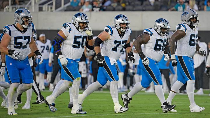 Carolina Panthers offensive lineman, tackle Monroe Freeling (57), guard Robert Hunt (50), center Luke Fortner (77), guard Damien Lewis (68), and tackle Rasheed Walker (63) line up for a snap Carolina Panthers offensive lineman, tackle Monroe Freeling (57), guard Robert Hunt (50), center Luke Fortner (77), guard Damien Lewis (68), and tackle Rasheed Walker (63) line up for a snap