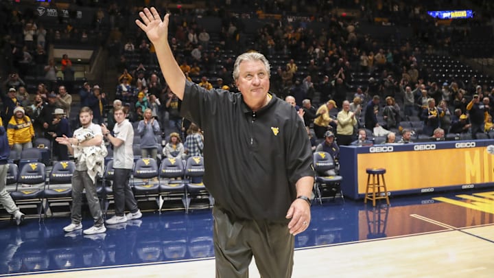 Nov 18, 2022; Morgantown, West Virginia, USA; West Virginia Mountaineers head coach Bob Huggins is honored for winning game No. 920 after defeating the Pennsylvania Quakers at WVU Coliseum. Mandatory Credit: Ben Queen-Imagn Images Nov 18, 2022; Morgantown, West Virginia, USA; West Virginia Mountaineers head coach Bob Huggins is honored for winning game No. 920 after defeating the Pennsylvania Quakers at WVU Coliseum. Mandatory Credit: Ben Queen-Imagn Images
