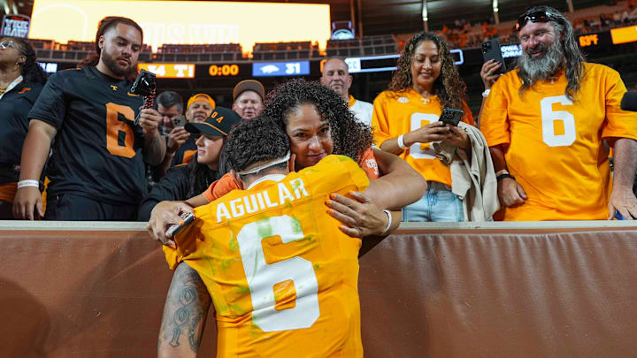 Tennessee quarterback Joey Aguilar (6) hugs his mom, Lydia Aguilar, after a college football game between Tennessee and Arkansas at Neyland Stadium in Knoxville, Tenn., on Oct. 11, 2025.
