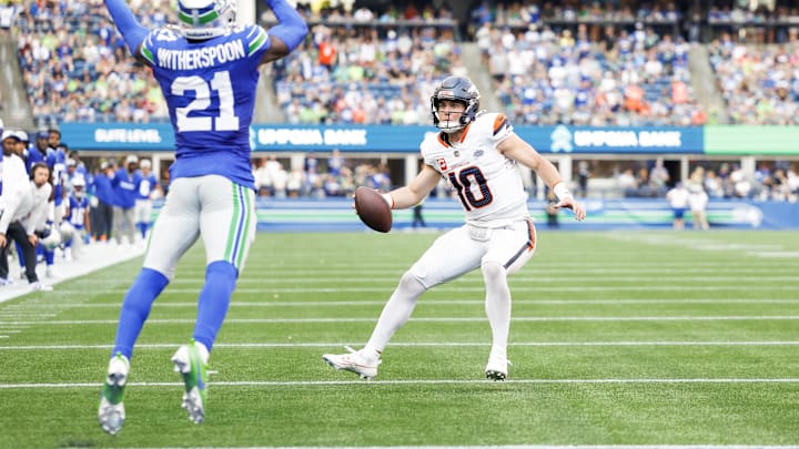 Sep 8, 2024; Seattle, Washington, USA; Denver Broncos quarterback Bo Nix (10) rushes for a touchdown against the Seattle Seahawks during the fourth quarter at Lumen Field. Mandatory Credit: Joe Nicholson-Imagn Images