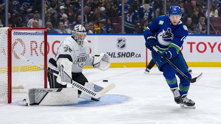 Jan 16, 2025; Vancouver, British Columbia, CAN; Vancouver Canucks forward Jake DeBrusk (74) redirects a shot towards Los Angeles Kings goalie Darcy Kuemper (35) in the second period at Rogers Arena. Mandatory Credit: Bob Frid-Imagn Images