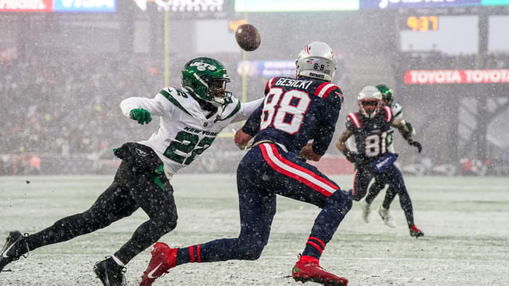Jan 7, 2024; Foxborough, Massachusetts, USA; New York Jets safety Tony Adams (22) defends against New England Patriots tight end Mike Gesicki (88) in the first half at Gillette Stadium. Jan 7, 2024; Foxborough, Massachusetts, USA; New York Jets safety Tony Adams (22) defends against New England Patriots tight end Mike Gesicki (88) in the first half at Gillette Stadium.