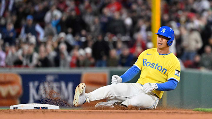 Apr 18, 2025; Boston, Massachusetts, USA; Boston Red Sox right fielder Rob Refsnyder (30) slides into second base during the fifth inning against the Chicago White Sox at Fenway Park. Mandatory Credit: Eric Canha-Imagn Images