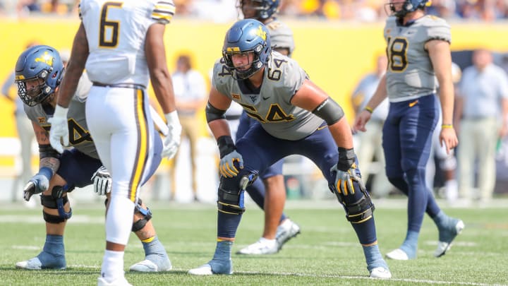 Sep 17, 2022; Morgantown, West Virginia, USA; West Virginia Mountaineers offensive lineman Wyatt Milum (64) during the second quarter against the Towson Tigers at Mountaineer Field at Milan Puskar Stadium. Sep 17, 2022; Morgantown, West Virginia, USA; West Virginia Mountaineers offensive lineman Wyatt Milum (64) during the second quarter against the Towson Tigers at Mountaineer Field at Milan Puskar Stadium.