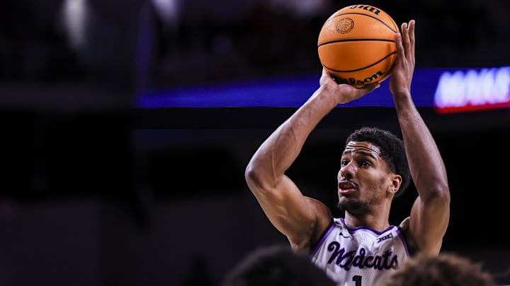 Mar 5, 2025; Cincinnati, Ohio, USA; Kansas State Wildcats guard David N'Guessan (1) shoots a free throw against the Cincinnati Bearcats in the second half at Fifth Third Arena. Mandatory Credit: Katie Stratman-Imagn Images