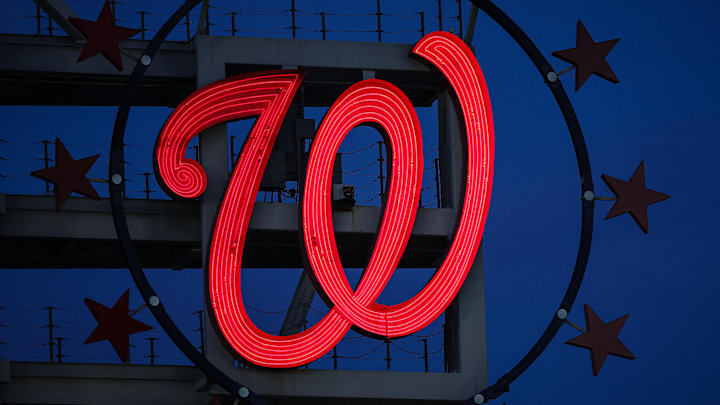 The Curly W, surrounded by 3 Stars on either side.