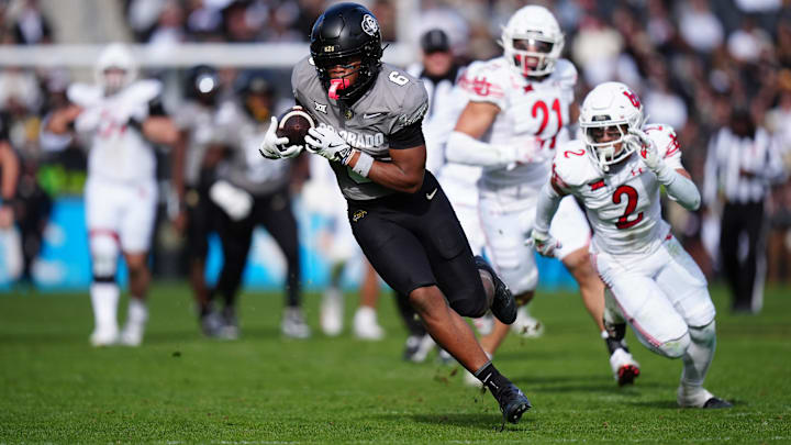 Nov 16, 2024; Boulder, Colorado, USA; Colorado Buffaloes wide receiver Drelon Miller (6) carries for a touchdown in the second half against the Utah Utes at Folsom Field. Mandatory Credit: Ron Chenoy-Imagn Images
