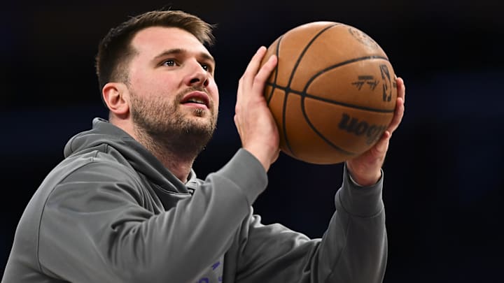 Apr 11, 2025; Los Angeles, California, USA; Los Angeles Lakers guard Luka Doncic (77) shoots before the game against the Houston Rockets at Crypto.com Arena. Mandatory Credit: Jonathan Hui-Imagn Images