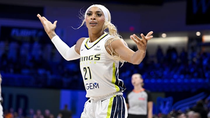 Jul 28, 2025; Arlington, Texas, USA; Dallas Wings guard DiJonai Carrington (21) reacts to a call during the first half against the New York Liberty at College Park Center. Mandatory Credit: Jerome Miron-Imagn Images
