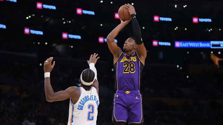 Nov 29, 2024; Los Angeles, California, USA: Los Angeles Lakers forward Rui Hachimura (28) shoots the ball against Oklahoma City Thunder guard Shai Gilgeous-Alexander (2) in the first half at Crypto.com Arena. Mandatory Credit: Kirby Lee-Imagn Images