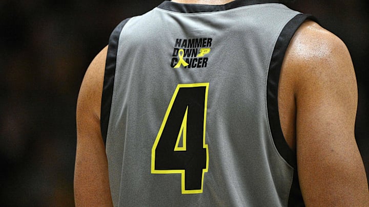 A detail photo of the Hammer Down Cancer logo on the back of Purdue Boilermakers forward Trey Kaufman-Renn (4) 