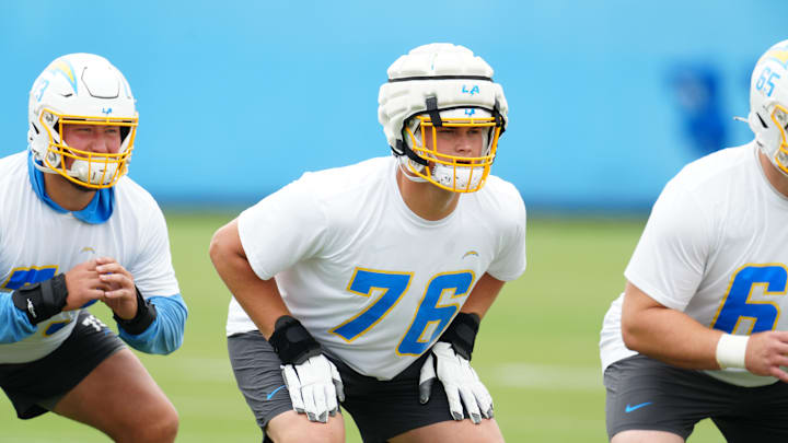 Los Angeles Chargers tackle Joe Alt (76) wears a Guardian helmet cap during organized team activities at the Hoag Performance Center. Mandatory Credit: Kirby Lee-USA TODAY Sports