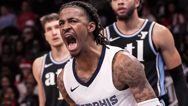 Dec 23, 2023; Atlanta, Georgia, USA; Memphis Grizzlies guard Ja Morant (12) reacts after dunking against the Atlanta Hawks during the second half at State Farm Arena. Mandatory Credit: Dale Zanine-USA TODAY Sports