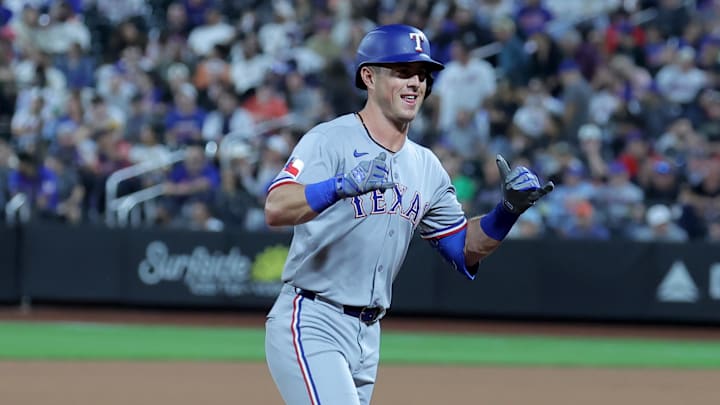Sep 12, 2025; New York City, New York, USA; Texas Rangers second baseman Dylan Moore (25) reacts as he rounds the bases after hitting a two run home run against the New York Mets during the seventh inning at Citi Field. Mandatory Credit: Brad Penner-Imagn Images Sep 12, 2025; New York City, New York, USA; Texas Rangers second baseman Dylan Moore (25) reacts as he rounds the bases after hitting a two run home run against the New York Mets during the seventh inning at Citi Field. Mandatory Credit: Brad Penner-Imagn Images