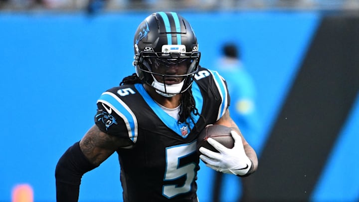 Dec 21, 2025; Charlotte, North Carolina, USA; Carolina Panthers running back Rico Dowdle (5) with the ball in the fourth quarter at Bank of America Stadium. 